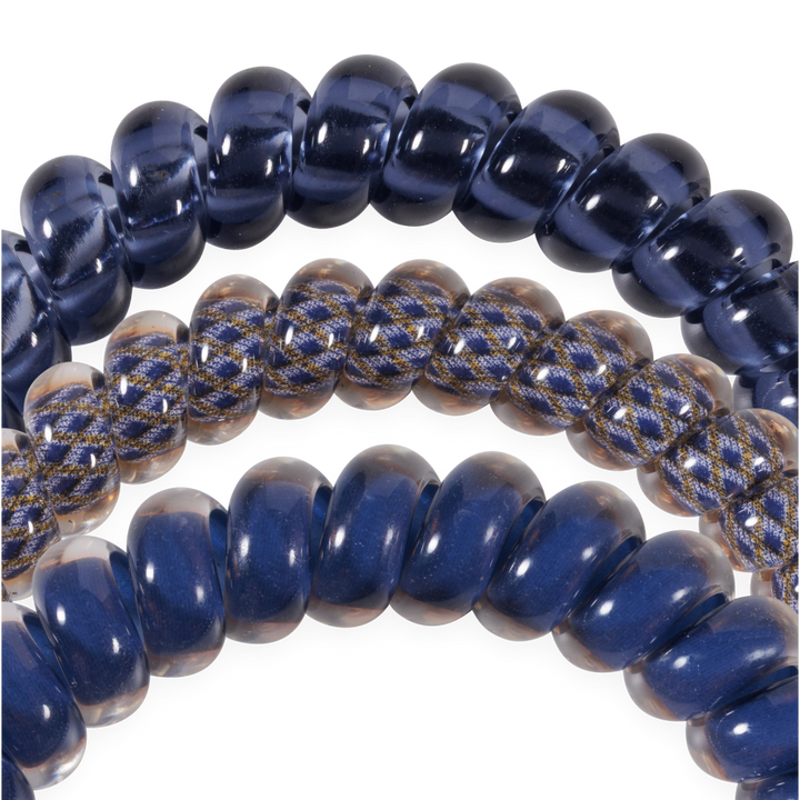Three small navy blue Twilight Tones Hair Ties—two solid, one with a braided pattern. Available in small size.