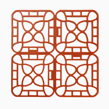 Four orange interlocking trivets with open geometric design; heat-resistant. Available sizes: small, medium, large.