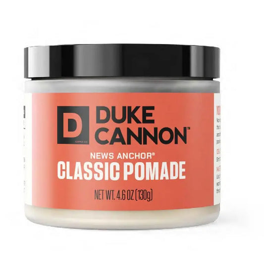 News Anchor Classic Pomade (4.6 oz) with black lid and orange label; natural matte finish, medium-to-strong hold. Available in 4.6 oz jar.