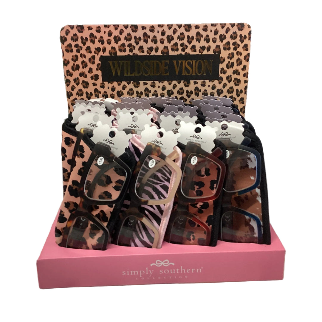 Display box of Wildside Vision Readers in various animal print sleeves and frame styles.