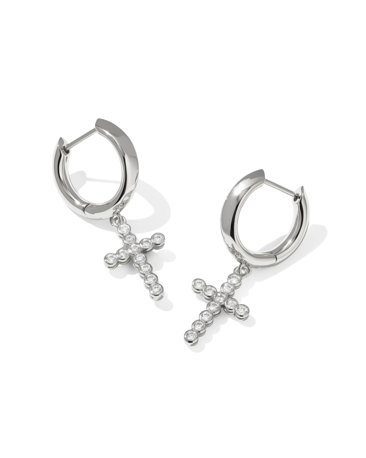 Silver Cross Crystal Huggie Earrings with small clear gemstones. Available in sizes 10mm, 12mm, and 14mm.