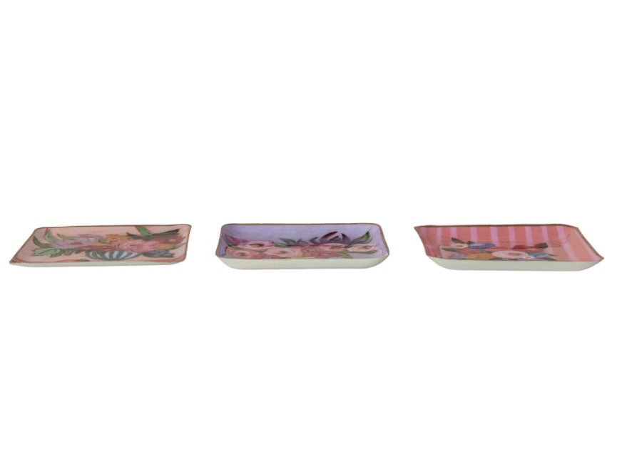 Set of three square enamel trays, hand-painted with pink, purple, and peach floral and striped designs. Available in small (4″), medium (6″), and large (8″) sizes. Suitable for use as a jewelry organizer or decorative accent.