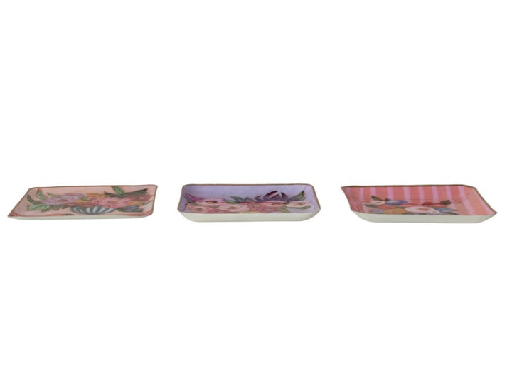 Set of three square enamel trays, hand-painted with pink, purple, and peach floral and striped designs. Available in small (4″), medium (6″), and large (8″) sizes. Suitable for use as a jewelry organizer or decorative accent.