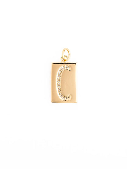 Gold rectangular pendant with a raised, stone-studded letter “C” on an 18k gold plated, hypoallergenic chain. Available in multiple sizes. Customizable necklace.