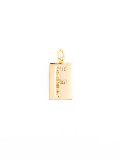 Thea Charm Bar is a customizable rectangular 18k gold plated pendant necklace featuring the letter “F” in clear stones, hypoallergenic. Available sizes: 16″, 18″, and 20″.