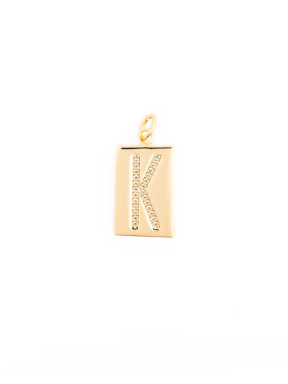 18k gold-plated rectangular pendant with a diamond-studded letter “K” at the center, attached to a small gold loop. Available in multiple sizes.