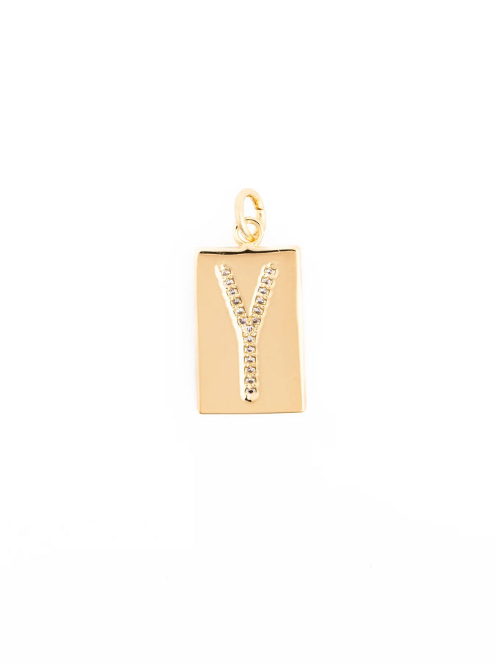Rectangular gold pendant with a diamond-studded “Y” at the center and a small top loop; available in multiple sizes.