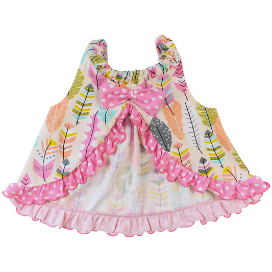 Back of swing top. Patterend with multicolored bright feathers and pink and white polka dot ruffle leading up to a pink and white polka dot bow. Open swing back.