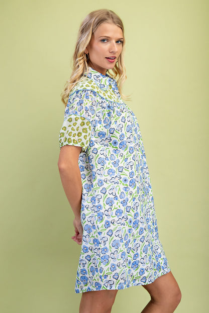 Miss Peony Floral Dress: loose, short-sleeved shirt dress with blue and green floral prints, patterned sleeves. Sizes XS–XL.
