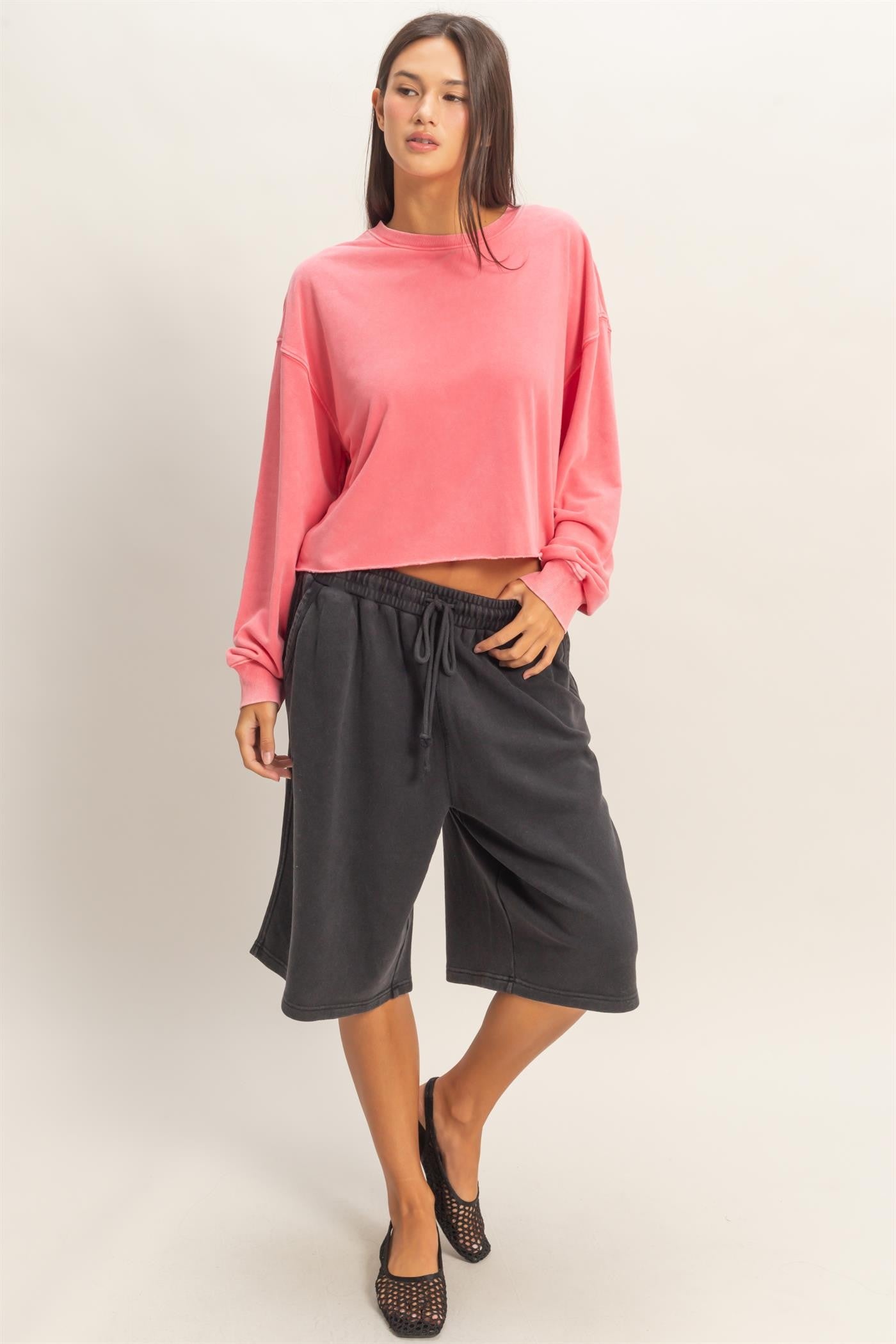 Cropped Mineral Wash Sweatshirt in pink, available in sizes XS-XL.
