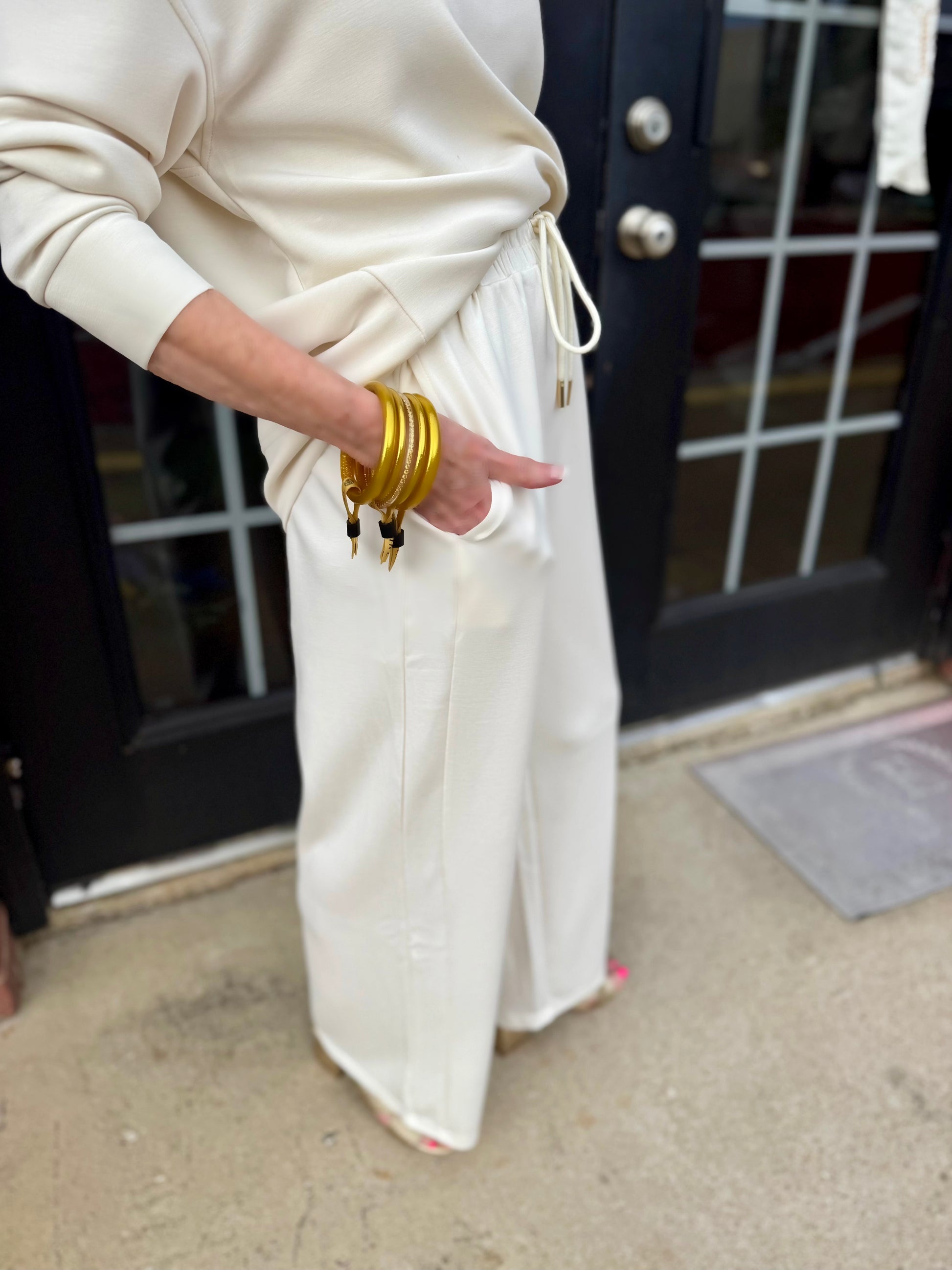 Hazel Ivory Pants in CloudSilk fabric, featuring a wide-leg silhouette; available in sizes XS–XL.