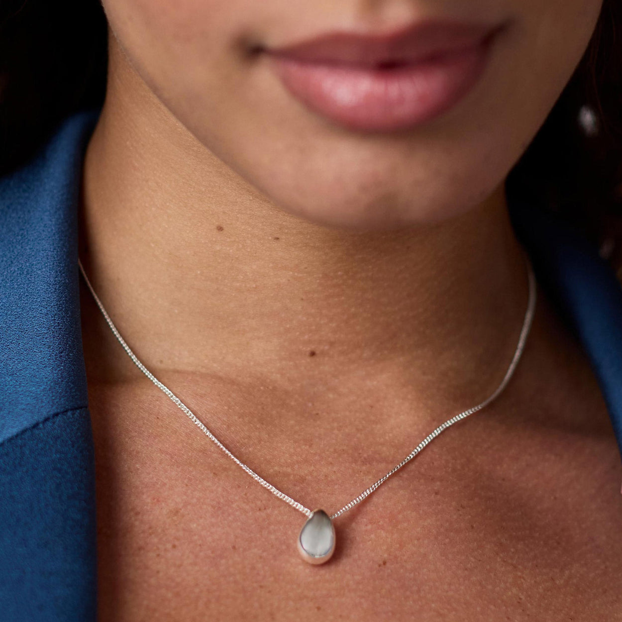 Wave Delicate Silver Necklace shown; available in 16", 18", and 20" lengths. Simple, minimalist silver wave design.