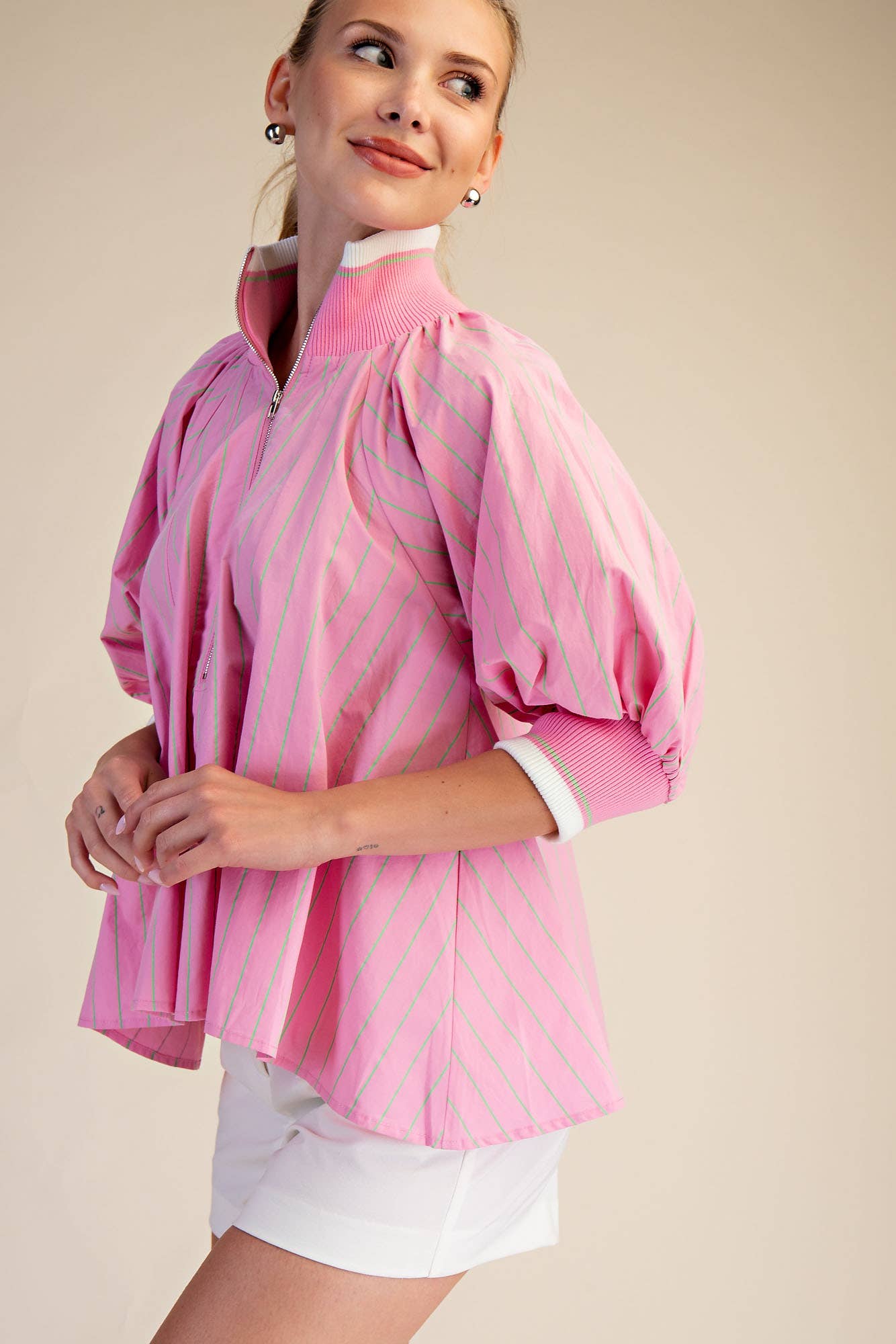 Pink Mock Neck Band Puff Sleeve Blouse with light diagonal stripes, quarter-zip. Sizes: XS-XL.