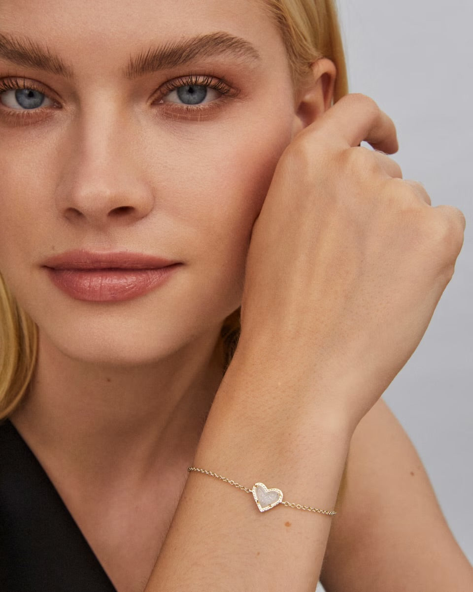 Ari Heart Gold Bracelet Iridescent Drusy by Kendra Scott, asymmetrical design, drusy heart charm. Available in 6", 6.5", 7".