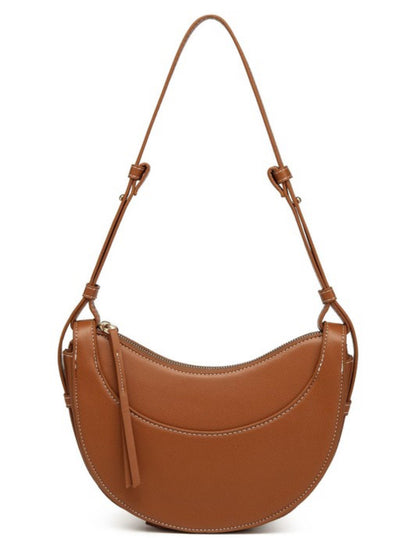 Brown crossbody purse with curved front pocket, zipper closure, adjustable strap, leather tassel. Sizes available: S, M, L.
