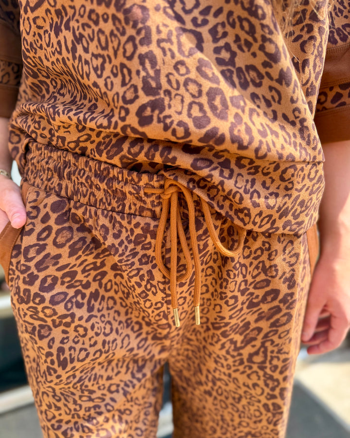 Leopard Contrast Pants with bold leopard print and adjustable drawstring waist, showing detailed pattern and fabric texture; available in sizes S–XL.