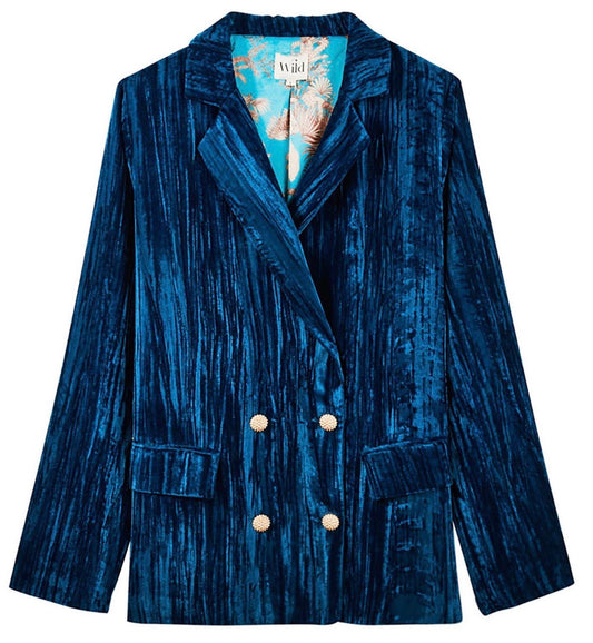 Kim Crushed Blue Velvet Jacket: double-breasted blue crushed velvet blazer with gold buttons, notched lapels, two front pockets, and floral-patterned lining. Available in sizes XS-XL.