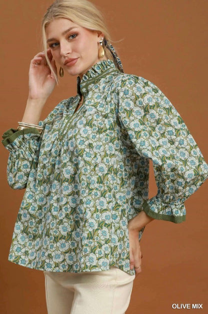Floral Mandarin Collar Blouse in an olive mix pattern, featuring a ruffled mandarin collar and loose sleeves. Lightweight fabric for easy wear. Available in sizes XS–XL. “OLIVE MIX” text shown.