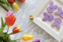 Purple bunny-shaped A Tisket, A Tasket Minis cookies with simple icing. Available in mini size.