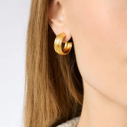 Shiny, textured 24K gold plated Cobblestone Hoop earring by Julie Vos in medium size; also available in other sizes.