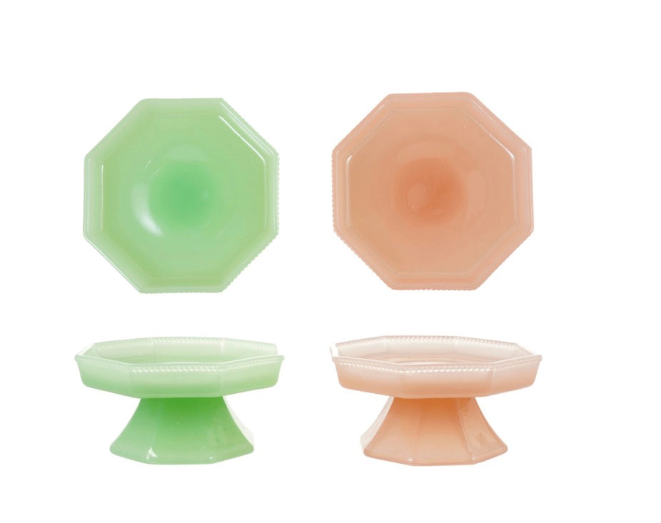 Pressed Milk Glass Pedestal dishes in green and pink with an octagonal, footed design; available in two sizes.