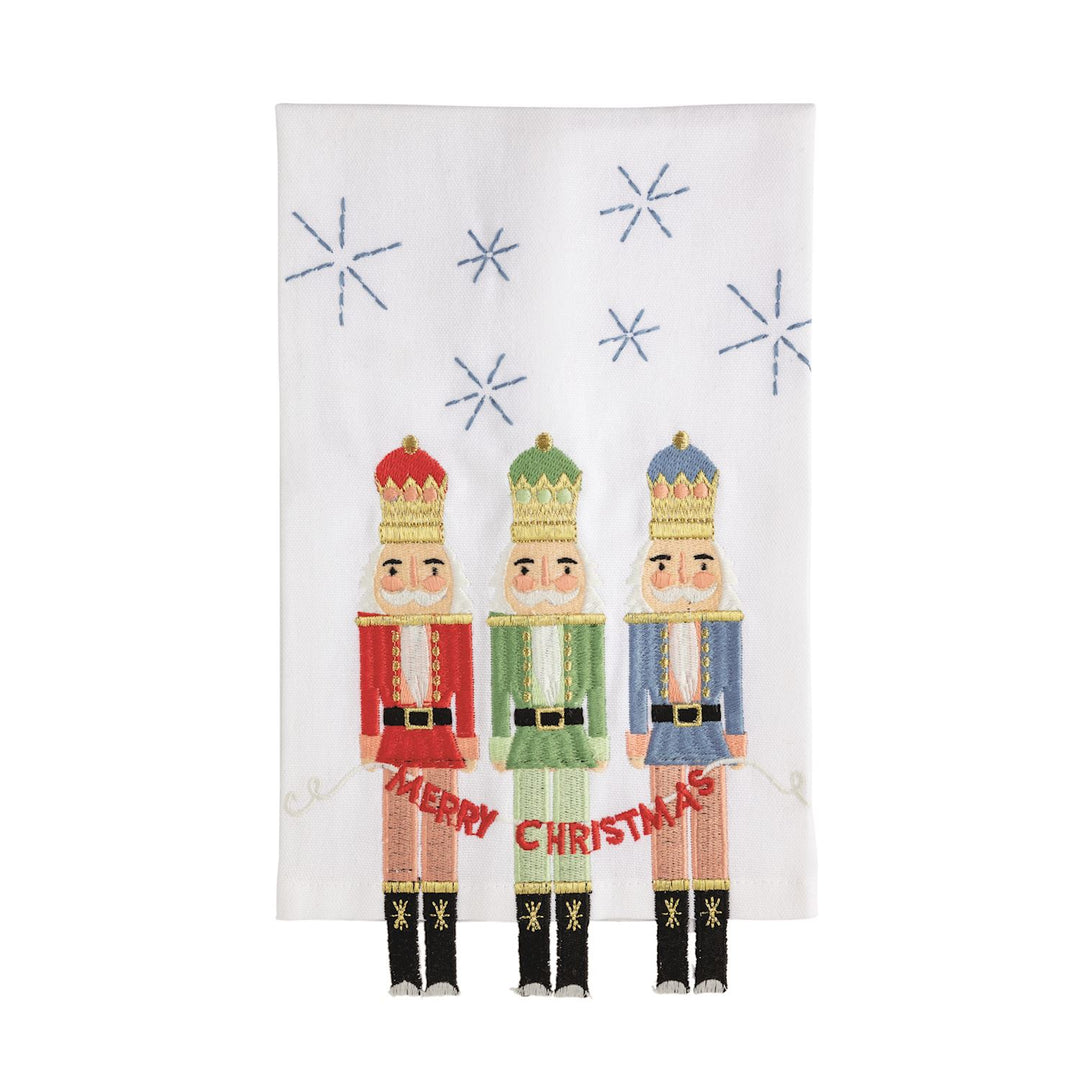 Nutcracker Dangle Leg hand towels featuring embroidered figures with a “Merry Christmas” banner, fabric legs, and snowflakes.