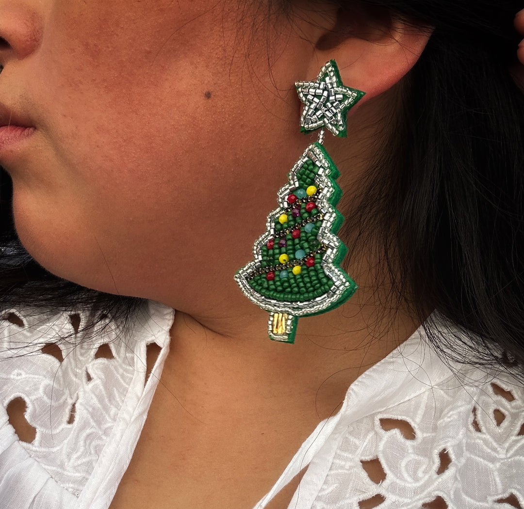 Beaded Christmas tree earrings with a star topper. Sizes available.