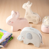 Set of three ceramic banks—pink rabbit, cream giraffe, gray elephant. Available in small and medium sizes.