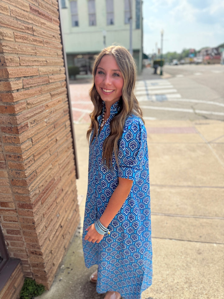 Bright Blue Printed Button Down Midi Dress; available in XS, S, M, L, XL; features vibrant print and button front.