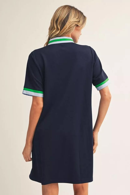 Short Sleeve Navy Zip Up Dress with green and white trim on collar and cuffs; available in sizes XS-XL.