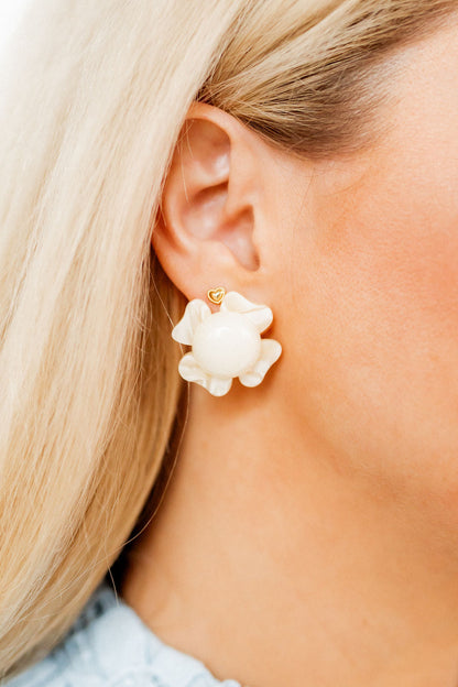 Amelia Earrings: large white flower with gold heart stud, surgical-grade stainless steel. Available in multiple sizes.
