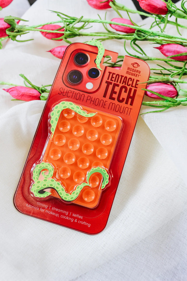 Tentacle Tech Suction Phone Mount: orange body, green tentacle design, hands-free grip. Sizes available: small, medium, large.