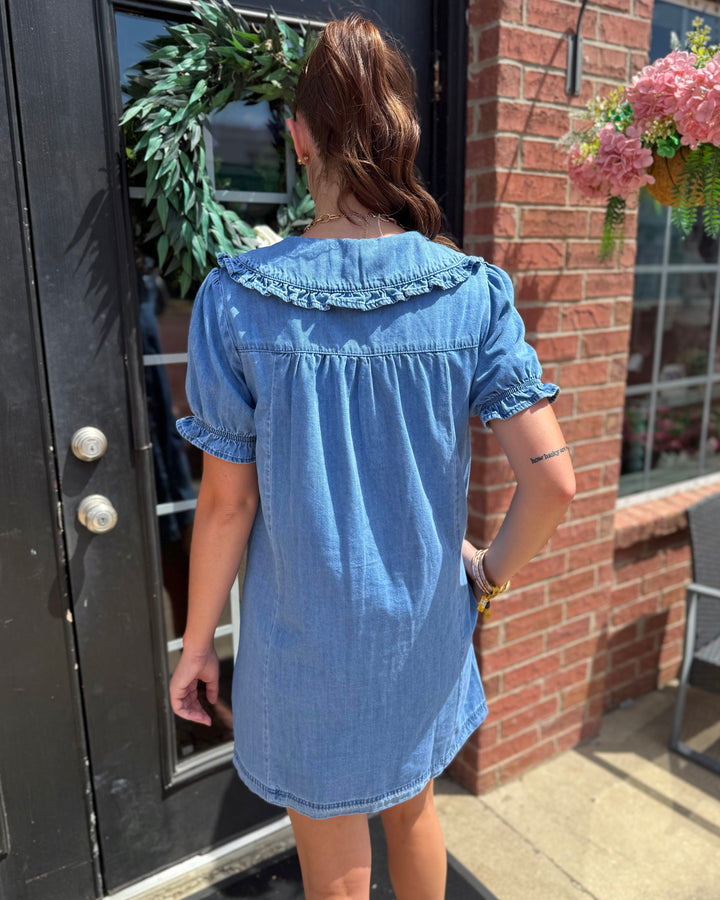 Denim Ruffle Collar Mini Dress featuring ruffled collar detail; available in sizes XS-XL.
