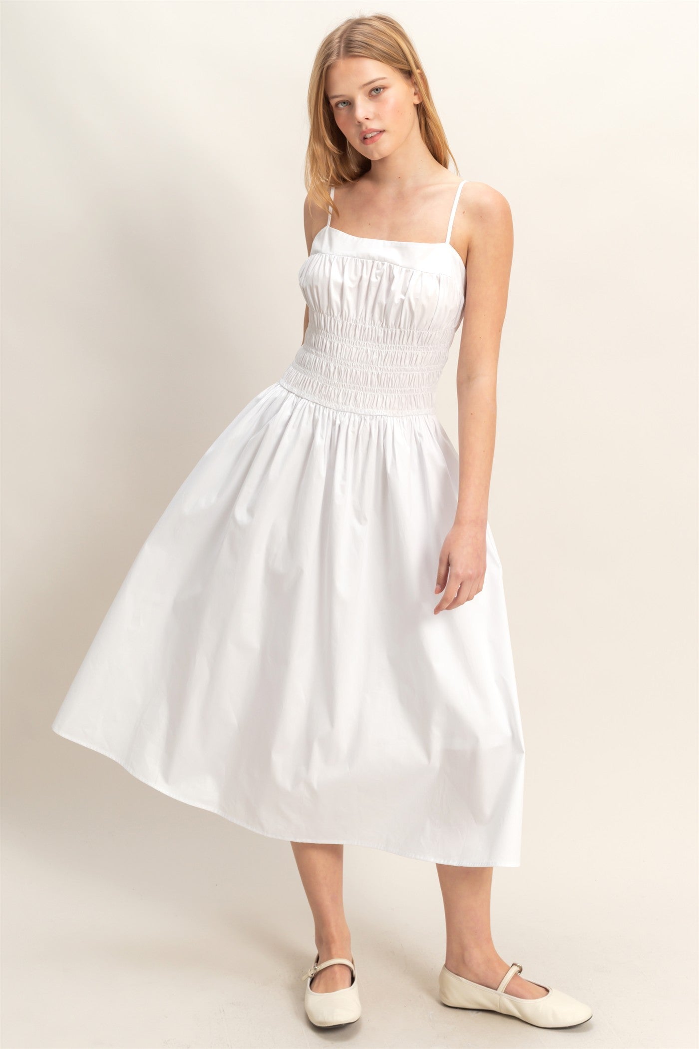 White Smocked Strapped Midi Dress with sleeveless design, smocked bodice, thin straps. Available in sizes XS-XL.
