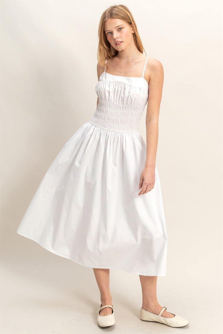 White Smocked Strapped Midi Dress with sleeveless design, smocked bodice, thin straps. Available in sizes XS-XL.