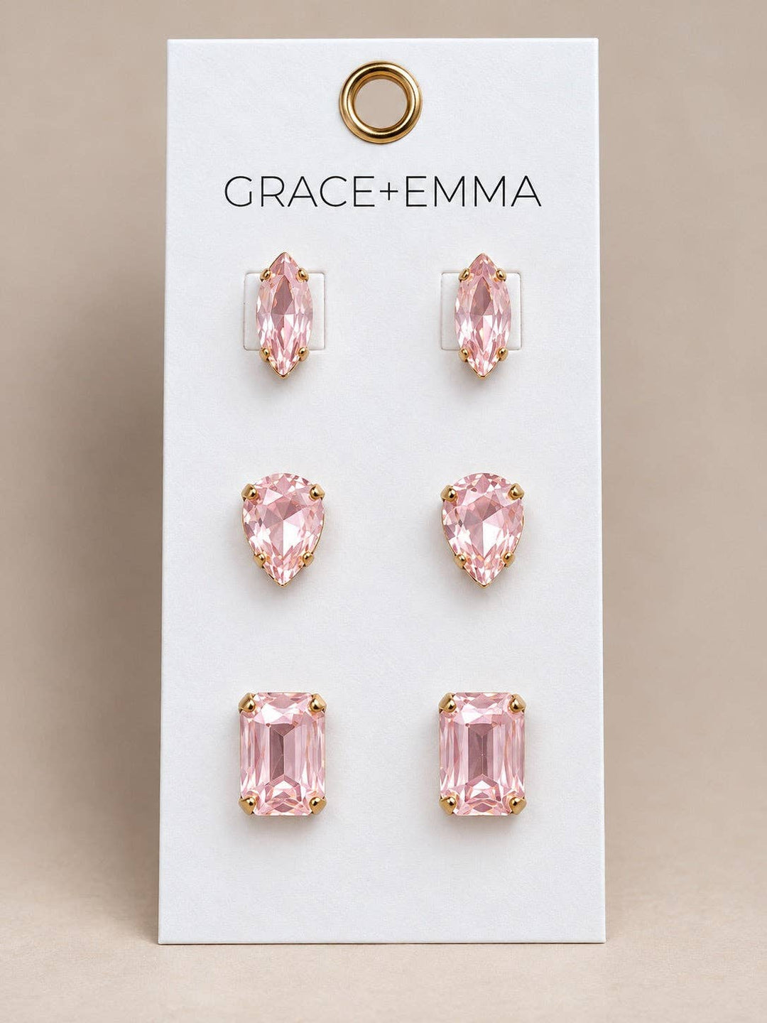 Light pink stone earrings in marquise, teardrop, and emerald cuts.