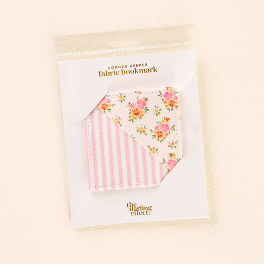 Quilted bookmark with pink stripes and floral pattern, labeled "Corner Keeper Fabric Bookmark–Endless Daydream Cream." Size not shown.