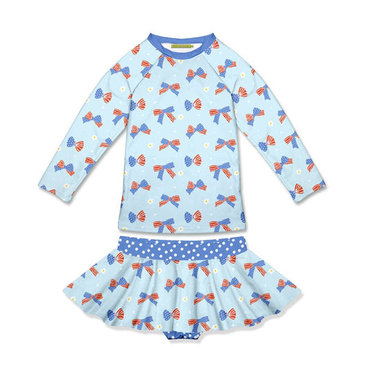 Light blue long-sleeve rashguard with patriotic bows, matching skirt, blue polka-dot waistband. Size: 2T.