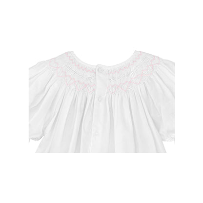 Back closure with buttons of White daygown with heart smocking and pearls