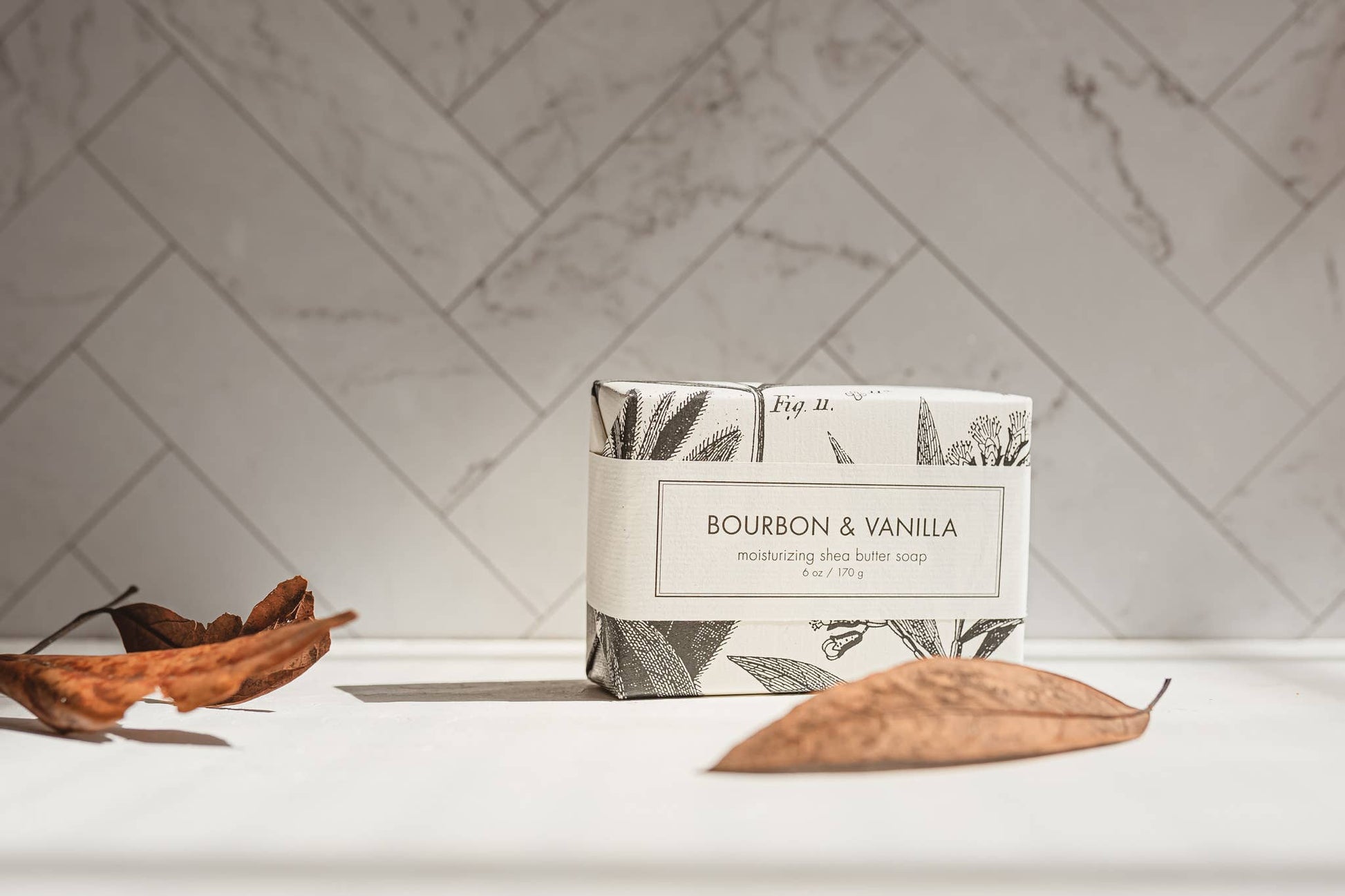 The product is a box of Bourbon & Vanilla Soap - Bath Bar. It evokes a natural vibe. The soap is available in bar size only.