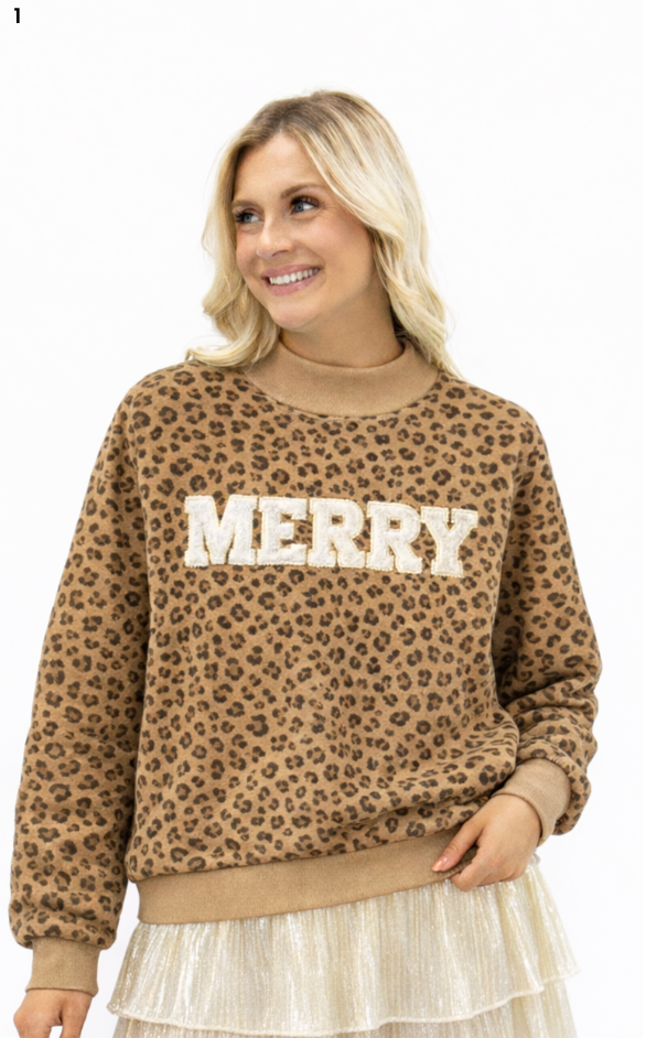 Brown and black leopard print mock neck top with white textured “MERRY” lettering.