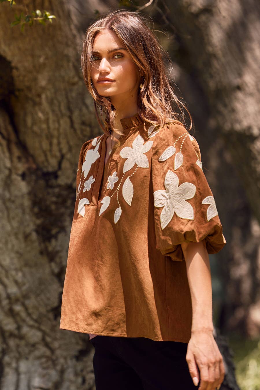 Washed Suede Top in camel with a loose fit and white floral embroidery, available in size S.