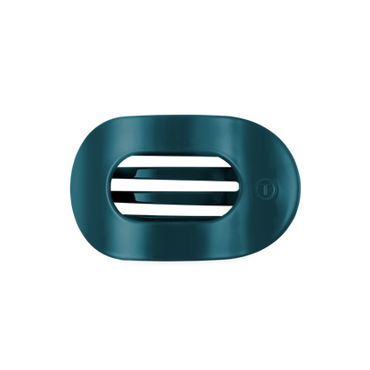 Dark teal, oval-shaped plastic soap dish with horizontal slots in the middle; available in standard size.