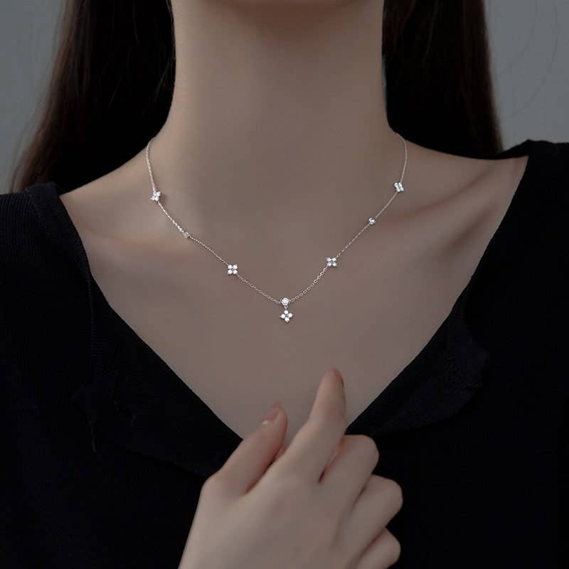 Four Petal Flower Friendship Necklace in 925 Sterling Silver with delicate four-petal pendants. Available in 16, 18, and 20-inch sizes.