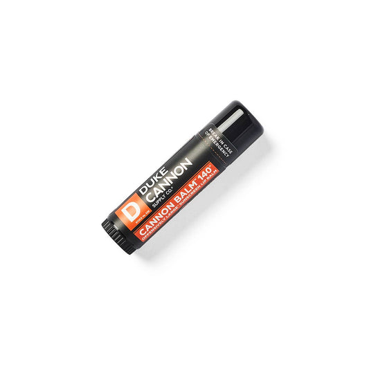 Cannon Balm Lip Balm 140° SPF 30 in a black tube with orange-and-white label, natural ingredients. Sizes: standard tube.