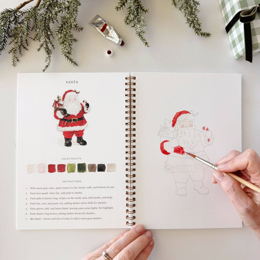 Classic Christmas watercolor workbook with step-by-step Santa Claus painting instructions.