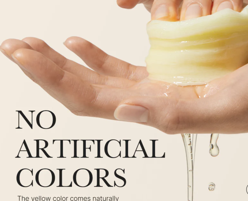 Yellow MEDICUBE Deep Vita C Pad squeezed, liquid released. Text: "NO ARTIFICIAL COLORS. Available in 70 &amp; 140 pad sizes.