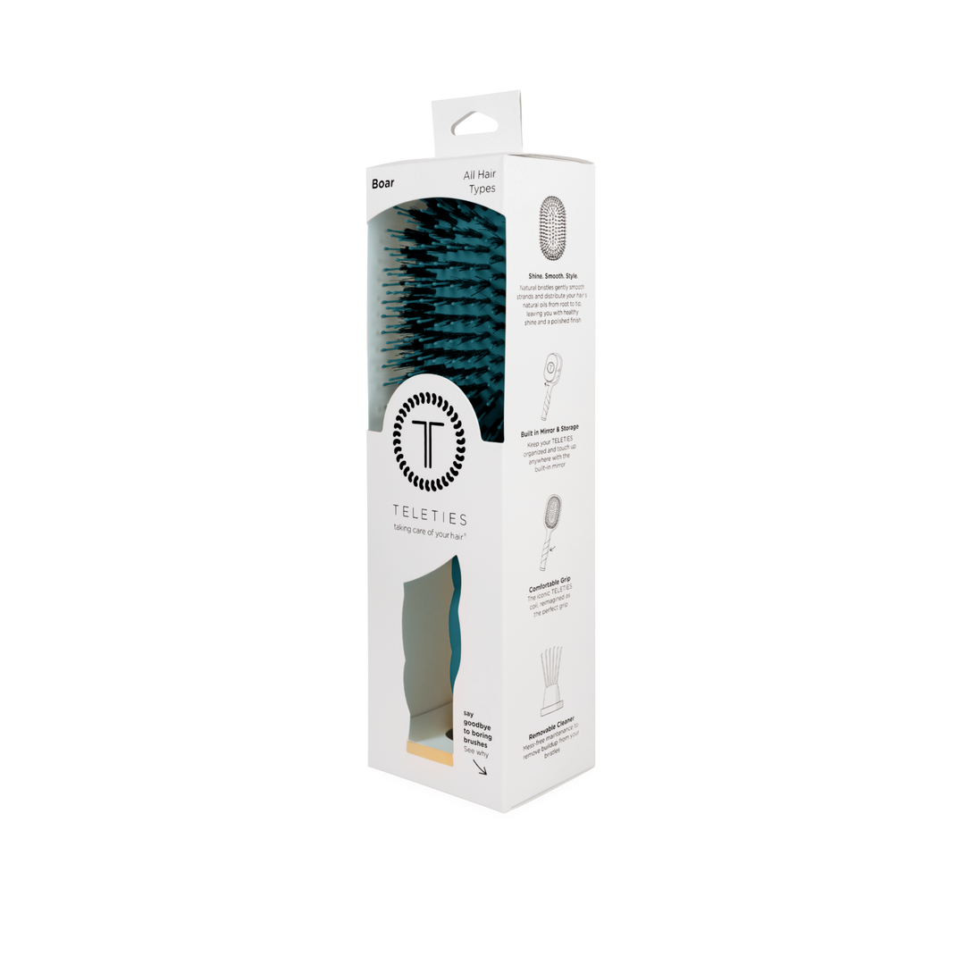 Boxed TELETIES Boar Bristle Hair Brush - Teal With It, for all hair types, in white packaging with black text, TELETIES logo, product details, and benefits like glossy finish and frizz control. Available in multiple sizes.