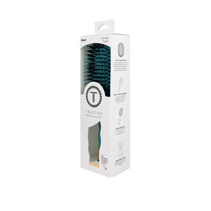Boxed TELETIES Boar Bristle Hair Brush - Teal With It, for all hair types, in white packaging with black text, TELETIES logo, product details, and benefits like glossy finish and frizz control. Available in multiple sizes.