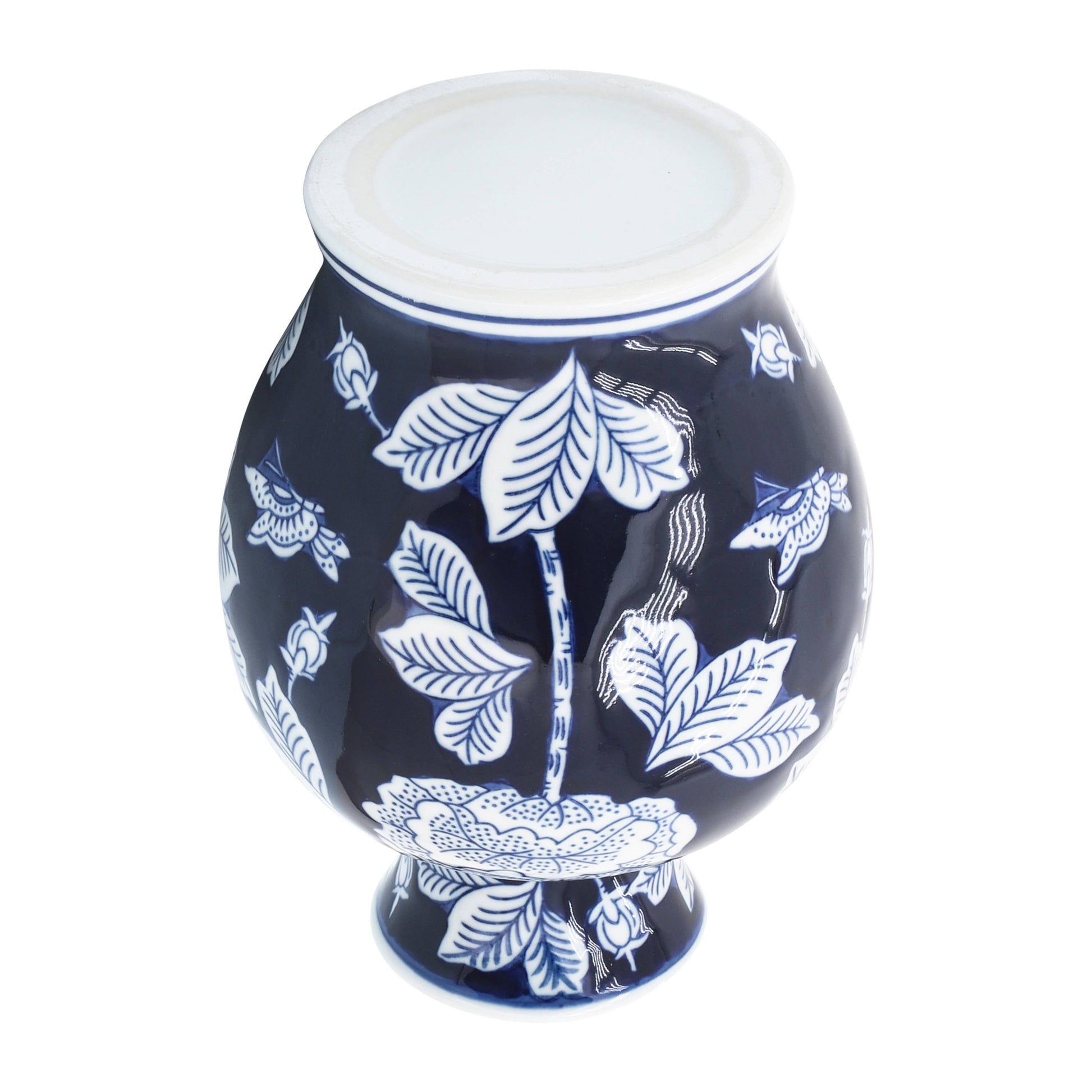 Blue ceramic chinoiserie vase, 9 in., rounded shape, blue and white floral pattern, wide base, white rim.